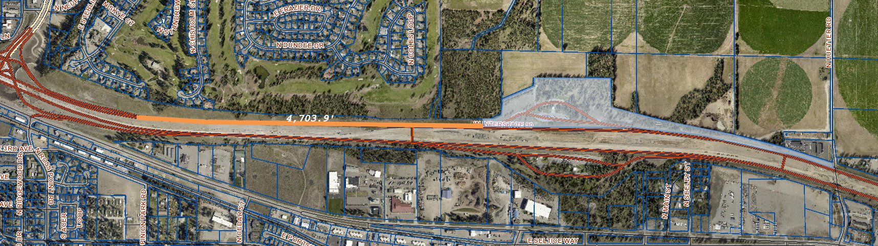 KCEarth parcel map of I-90 with a 4,703.9 ft measurement from the SH-41 interchange ramps to State-owned land at Huetter Road